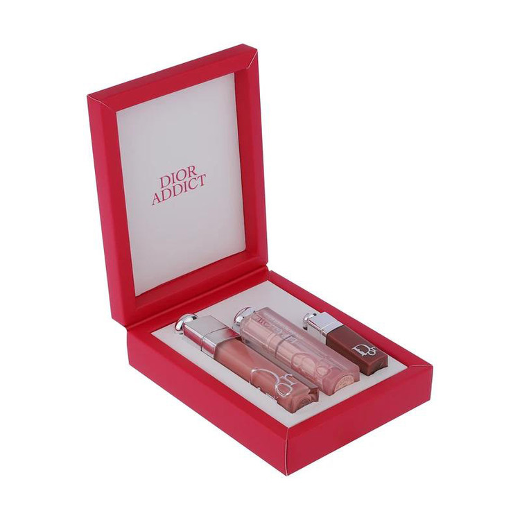 ست بالم و برق لب حجم دهنده دیور مدل Addict Trio Gloss آبرسان، دارای عصاره جوجوبا و مناسب پوست لب معمولی، بسته 3 عددی