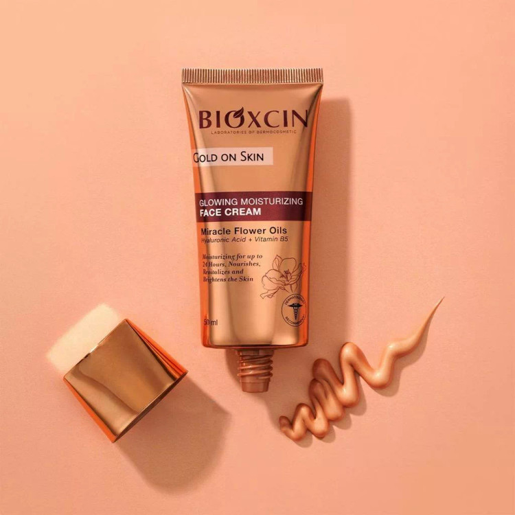 كرم پودر مرطوب كننده و براق كننده لومی گلوشن بيوكسين Bioxcin مدل Gold On Skin حجم 50 ميل